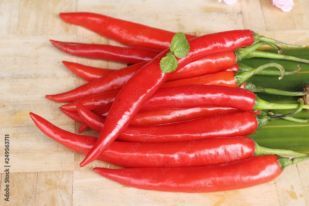 Red chili for cooking on wood background