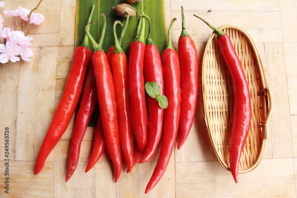 Red chili for cooking on wood background