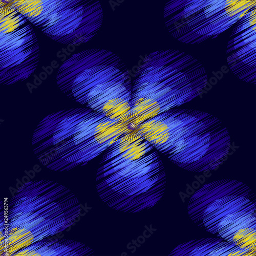 blue abstract flower with linear texture on a dark background