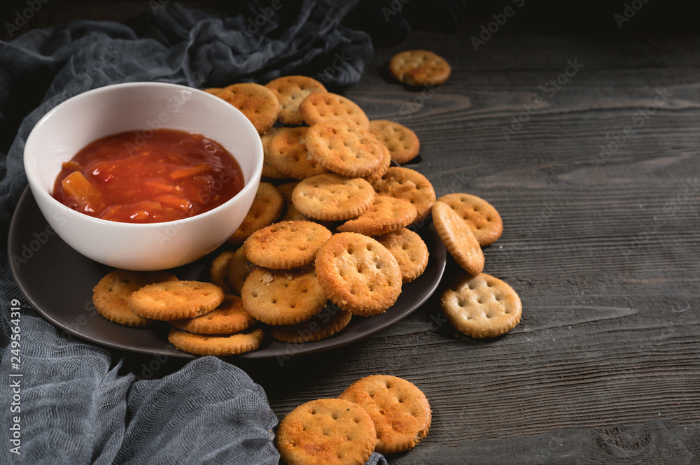 Dry thin crackers with tomato sauce Dry thin crackers with tomato sauce