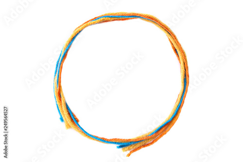 Colorful circle frame made of thread isolated on white background. Empty frame of cotton thread.