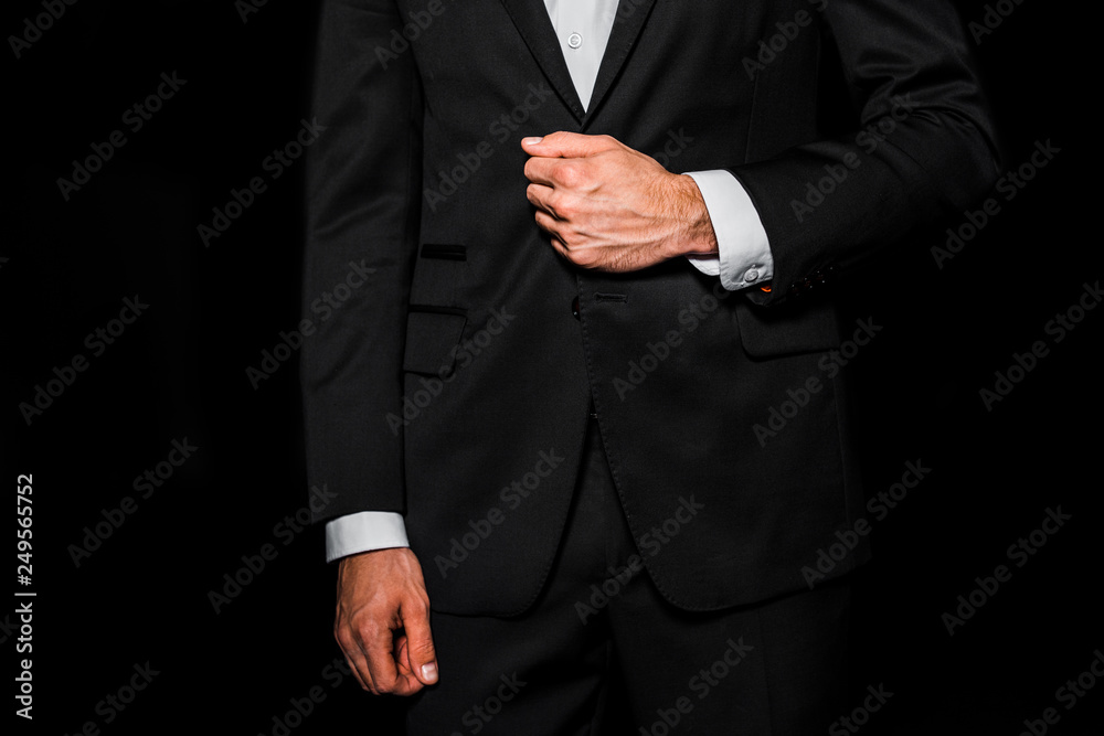 cropped view of man posing in jacket isolated on black