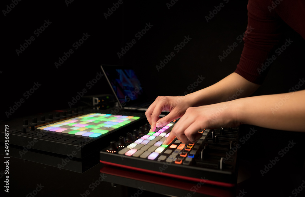 Fototapeta premium Dj hand remixing music on midi controller