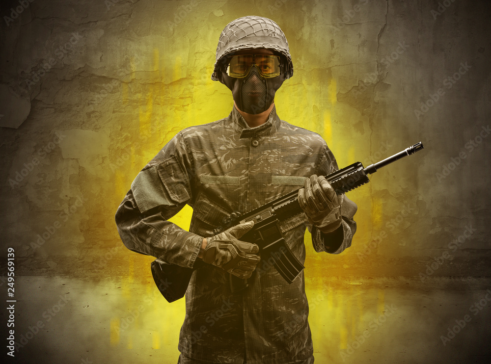 Hazard, menace soldier in a ruined crumbly building with arms on his hand
Hazard, menace soldier in a ruined crumbly building with arms on his hand