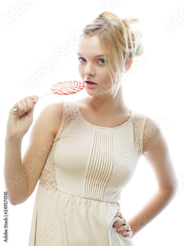 Young blond woman with candy