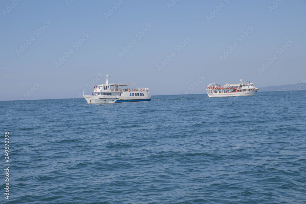 A large private motor yacht under way out at sea A large private motor yacht under way out at sea