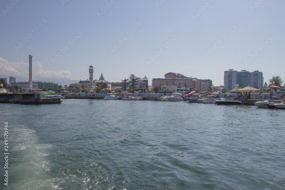 Obraz premium The city embankment, View From Sea. View From Sea Of Embankment Of The Georgian Resort Town