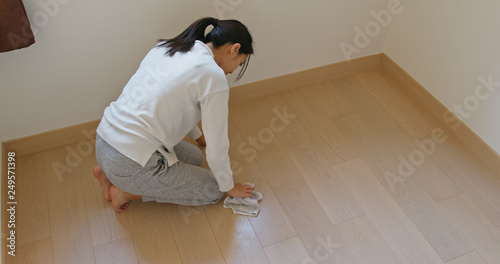 Woman clean the floor for spring clean at home © leungchopan
