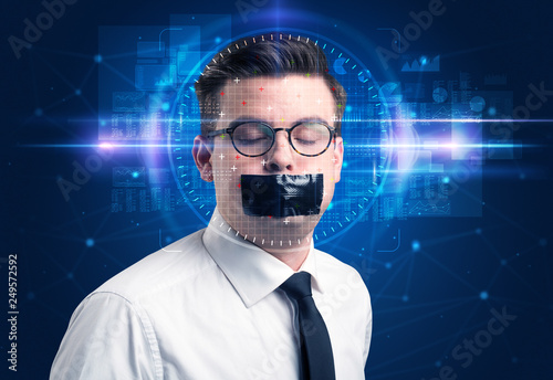 Facial recognition system. Young man on blue background