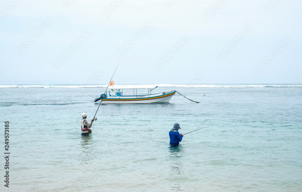 Naklejka premium Fishing boats in the ocean on the island of Bali