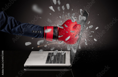 Strong male hand breaks laptop screen  © ra2 studio