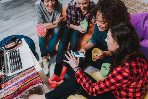 Photography Cheerful women watching at screen of smartphone
