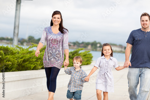 Happy Young Family Walking Together Outside