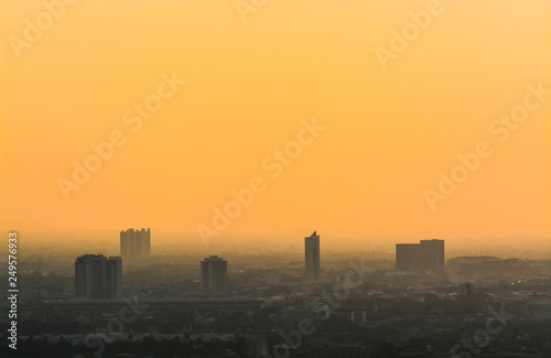 Air pollution of City with orange sky background,dust 2.5 Particulate Matte.