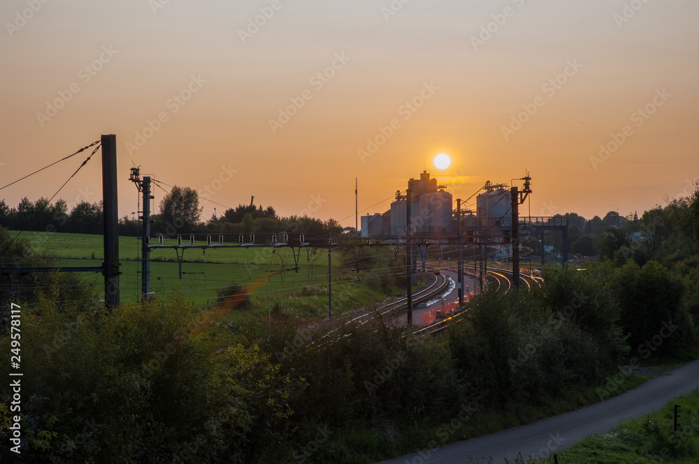 Obraz premium Beautiful sunset over the fields