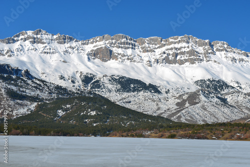 views of the frozen lake and the snowy mountains