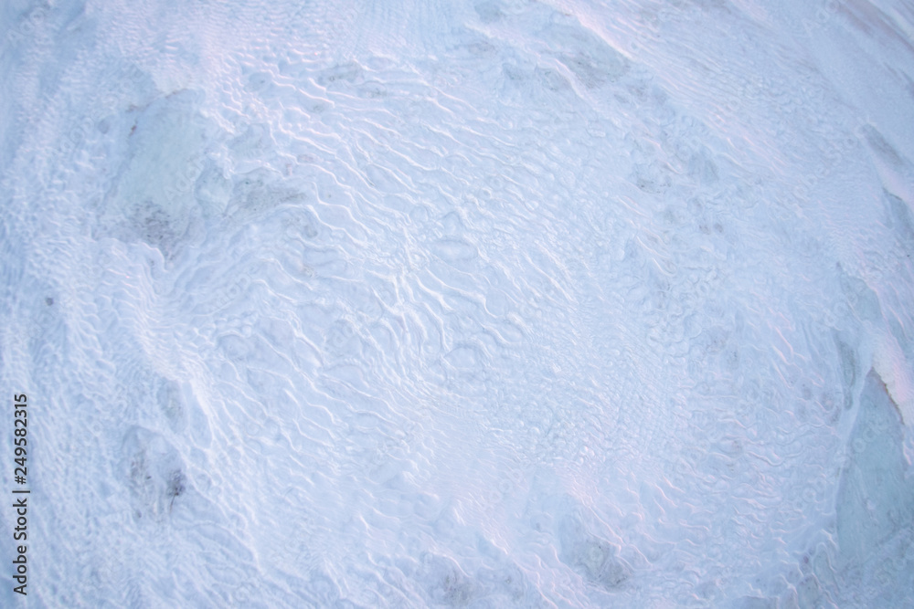 texture of white limestone on the hot springs of Pamukkale