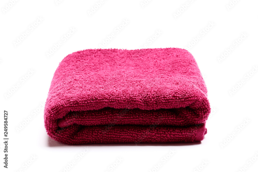 Burgundy towel isolated on white background. Insulation.