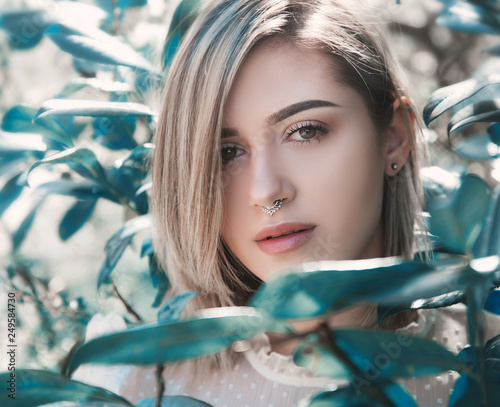 Young woman close up portrait in nature photo