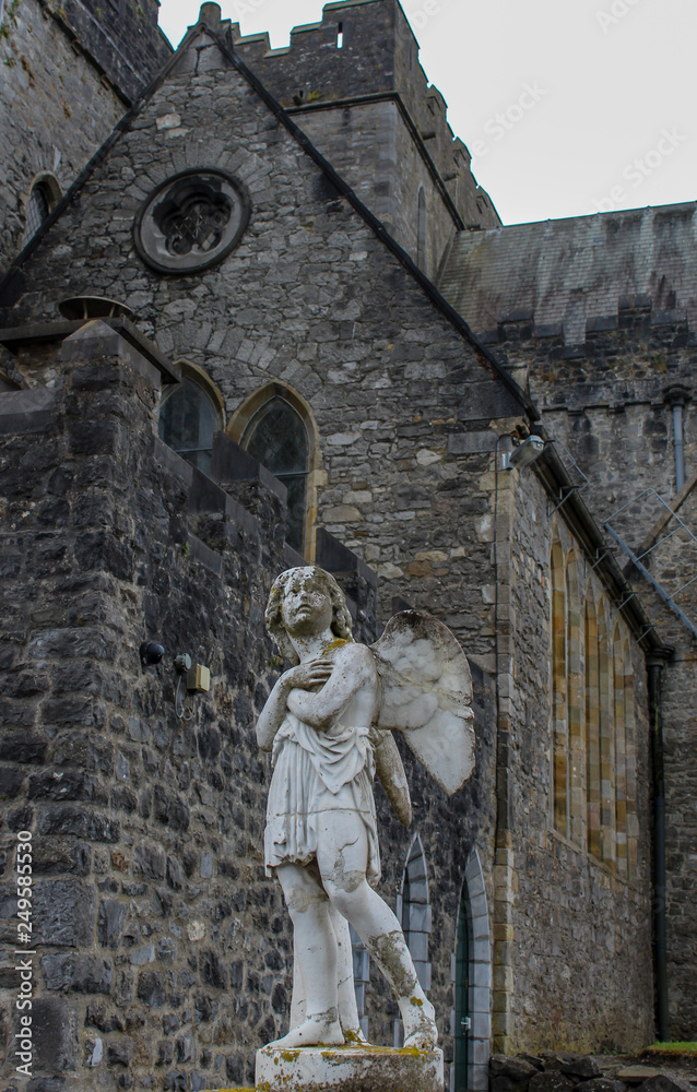 statue of an angel in front of a church, Kilkenny, Ireland