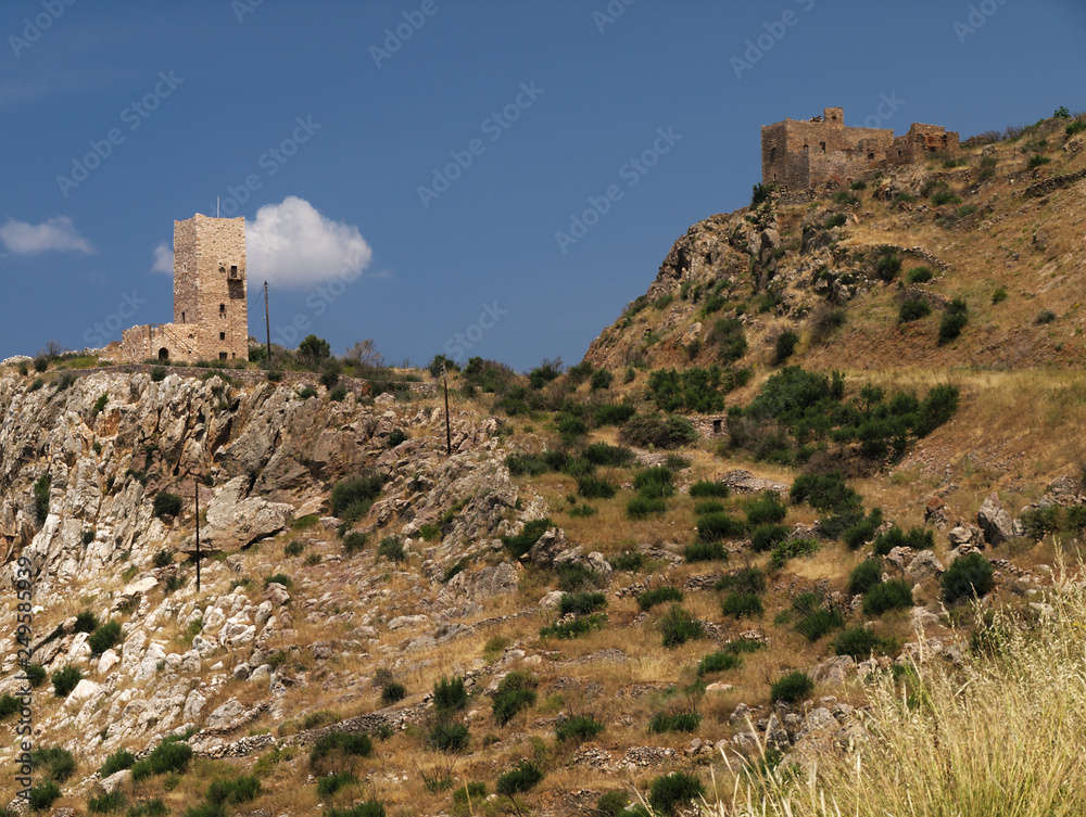 Tower  on a cliff  in Mani, Greece under blue sky in day light
