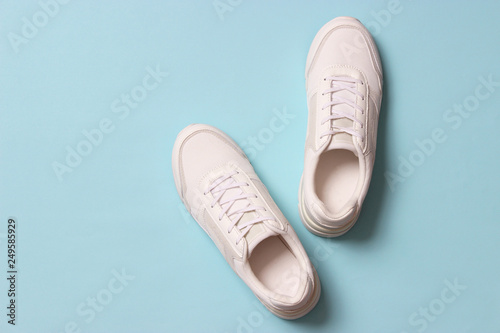 Wallpaper Mural women's sneakers on a colored background top view. Women's shoes. Torontodigital.ca