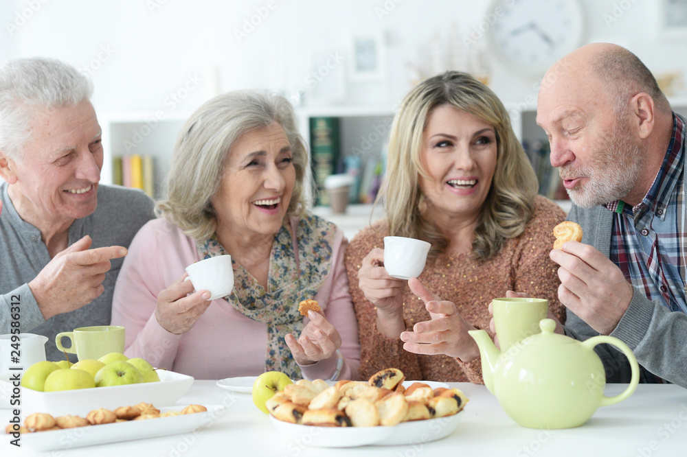 Portrait of two senior couples having breakfast