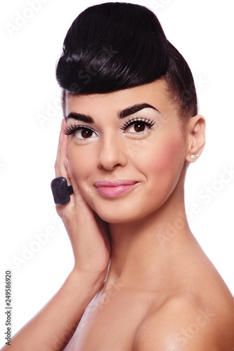 Portrait of young beautiful woman with stylish make-up and fancy hairstyle