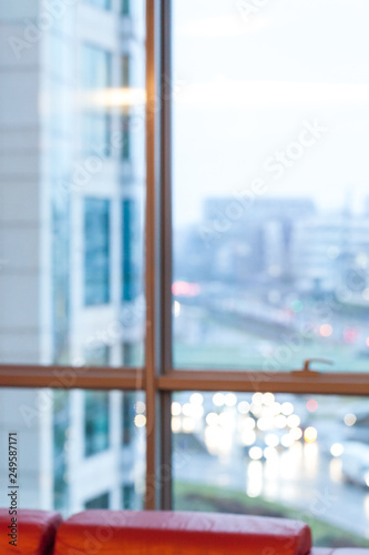 Blurred background : office interior with blurred wiev in rainy day