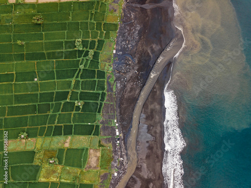 Indonesia, Bali, Keramas, Aerial view of Klotok beach, rice fields photo