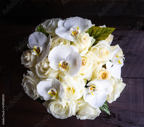 Gift box with roses and orchids photo