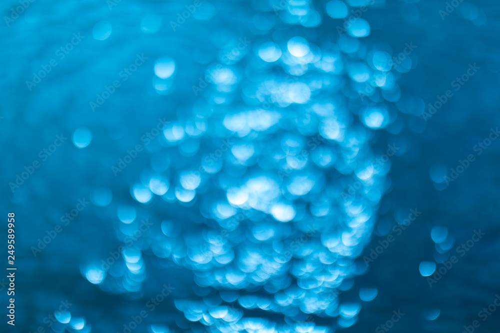 abstract blue background with bokeh lights. Defocused or blurred blue water background. abstract blue background with bokeh lights. Defocused or blurred blue water background.