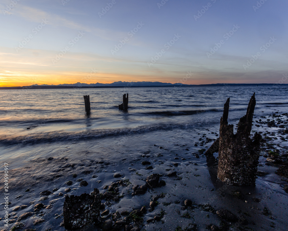 A beautiful glow above the Olympic Mountains at Golden Gardens Park in Seattle, Washington.