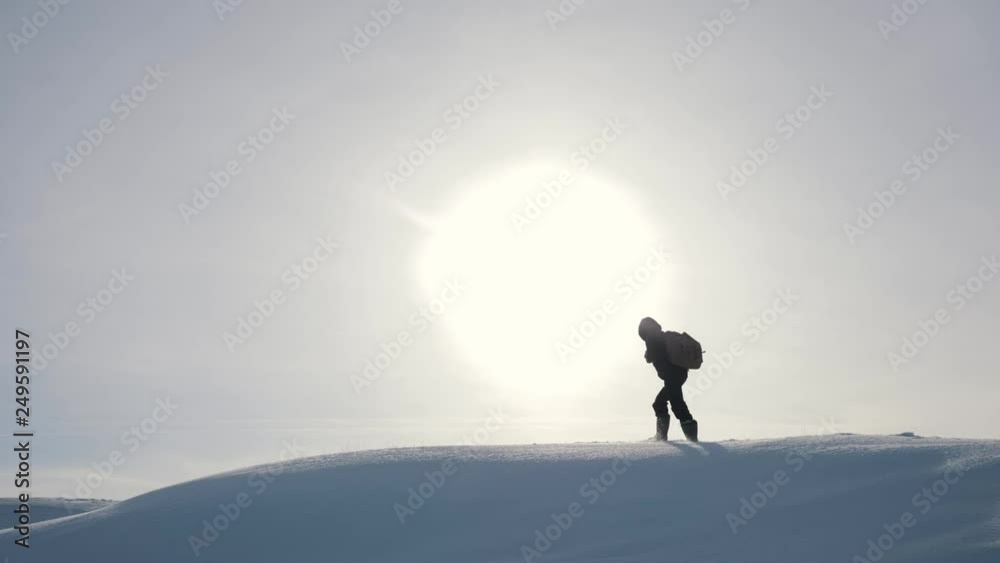 Tourists teamwork, climbing the mountain, helping each other, reaching the top. Overcoming difficulties, helping hand.