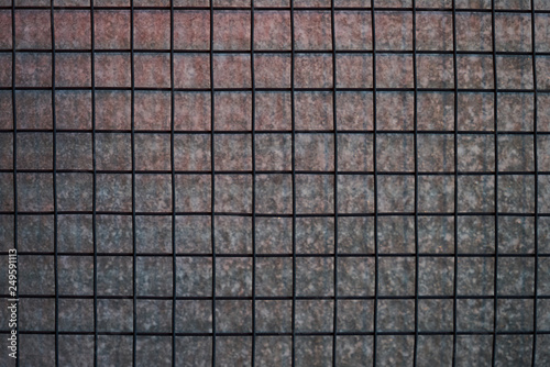 Metal net square with gray concrete wall texture background.