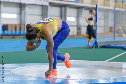 Professional female athlete at shot put sector