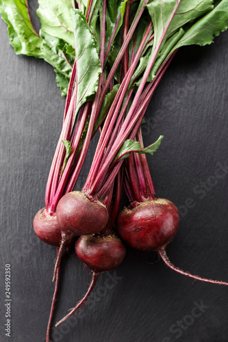 young beets on a black background