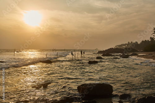 Fishermen in Sri Lanka fishing at sunset 