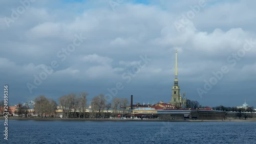 Timelapse clip of moving clouds over The Peter and Paul Cathedral in Saint-Petersburg, Russia. The Peter and Paul fortress. photo