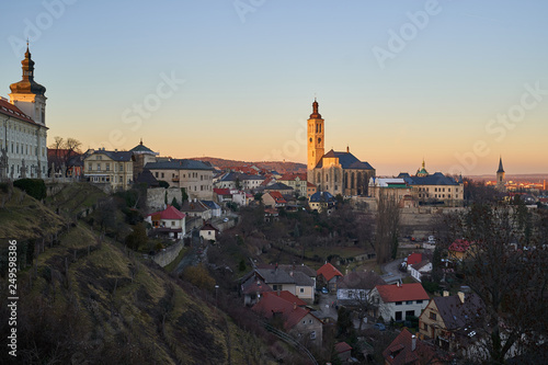 Landscape or cityscape Picture of Kutna hora town with Saint James church, full of historic buildings from ancient age in gothic style during sunset in spring, world heritage of Unesco. Czech Republic