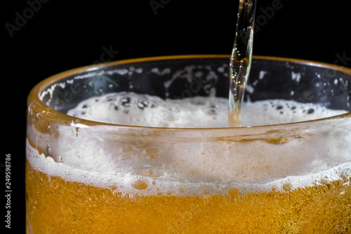 Wallpaper Mural Beer into glass, close-up. Alcoholism concept Torontodigital.ca