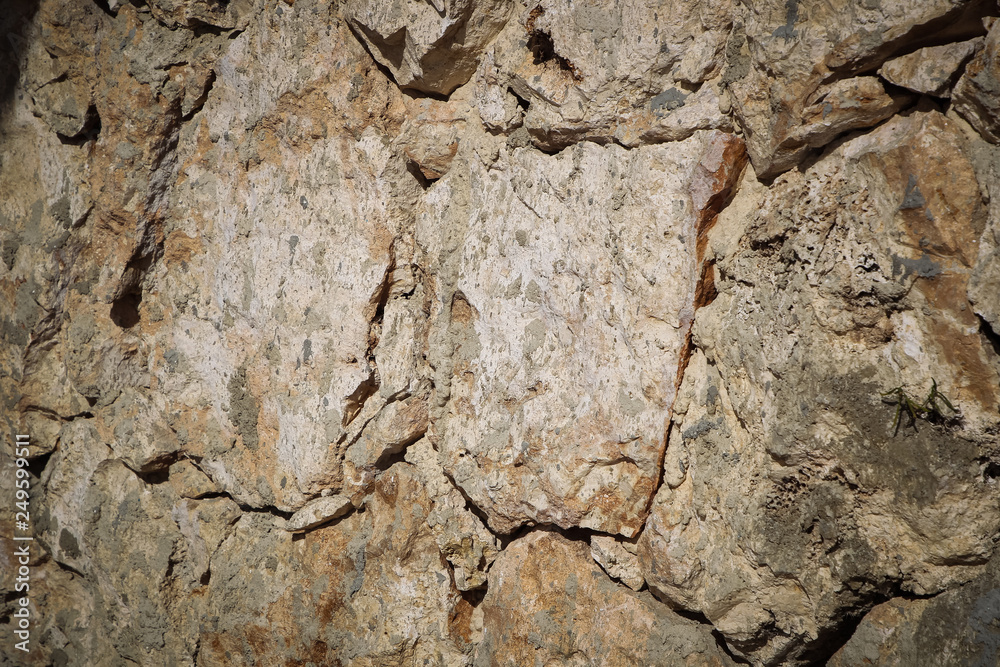 Fototapeta premium Stone wall of warm tones background