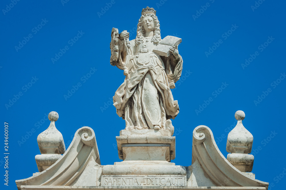a statue of a queen on the building