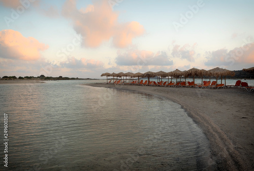 Pink sand and turquoise water early in the morning at Elafonisi Lagoon, Crete Island, Greece