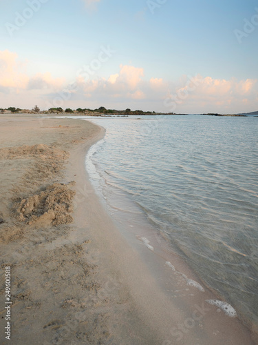 Pink sand and turquoise water early in the morning at Elafonisi Lagoon, Crete Island, Greece