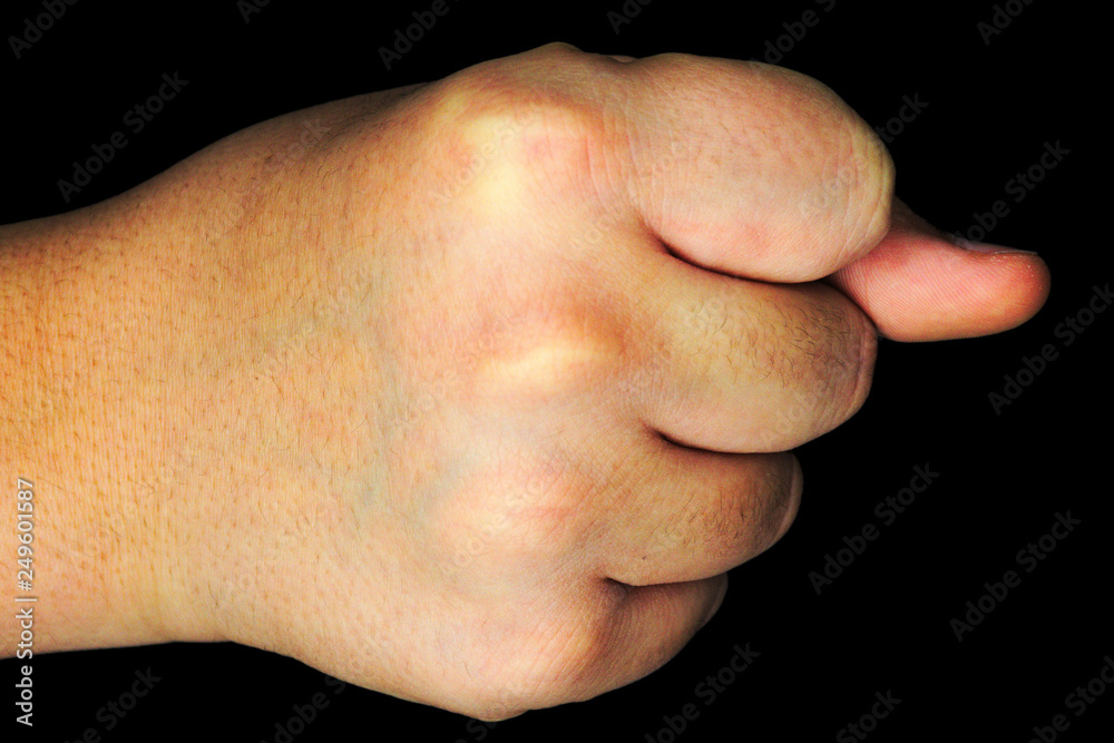 hand photographed in closeup. the background is black hand photographed in closeup. the background is black