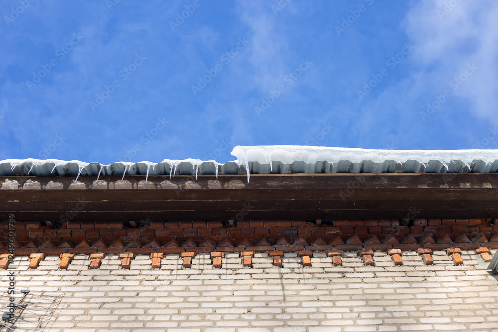 icicles on the roof in the spring
