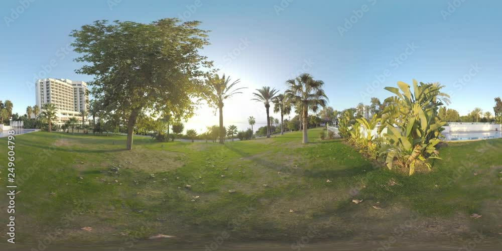 360 VR video. Green area with palms and outdoor swimming pool near the hotel. Vacation on the coast of Antalya, Turkey 360 VR video. Green area with palms and outdoor swimming pool near the hotel. Vacation on the coast of Antalya, Turkey