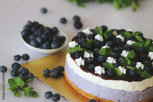 Blueberry souffle mousse cake decorated with fresh berries