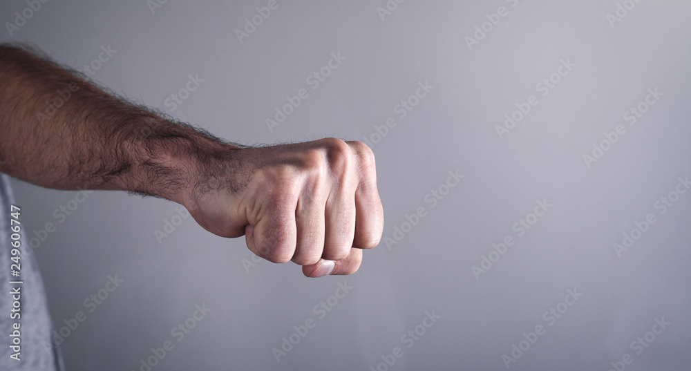 Obraz premium Caucasian angry and aggressive man threatening with fist.